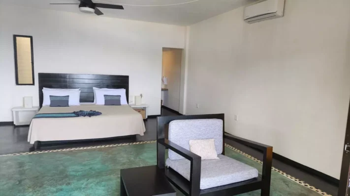 Photo of a room in Hotel Manta Raya featuring a king size bed, ceiling fan and air conditioning